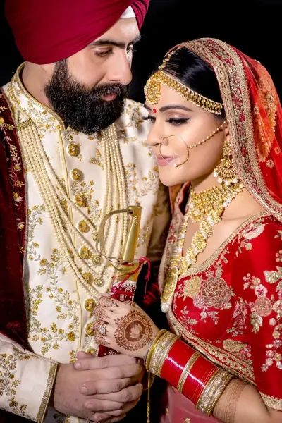 Sikh wedding photography with their traditional wedding attires.