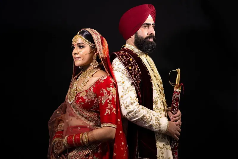 Sikh wedding couple photoshoot with their faces on opposite direction.