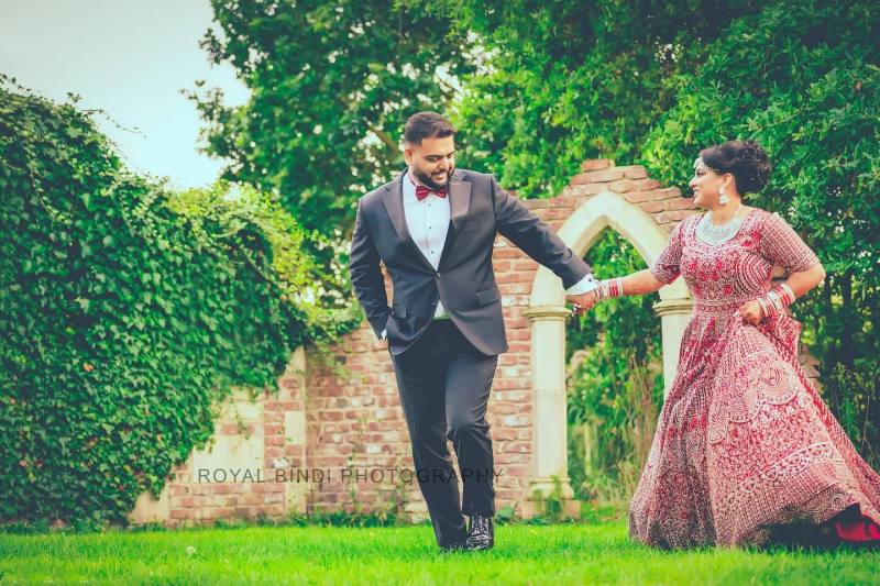 Couple, frolicking in a garden