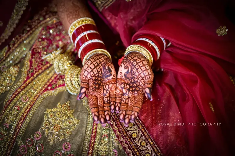 Bride showing her hands full of Henna (Mehndi)