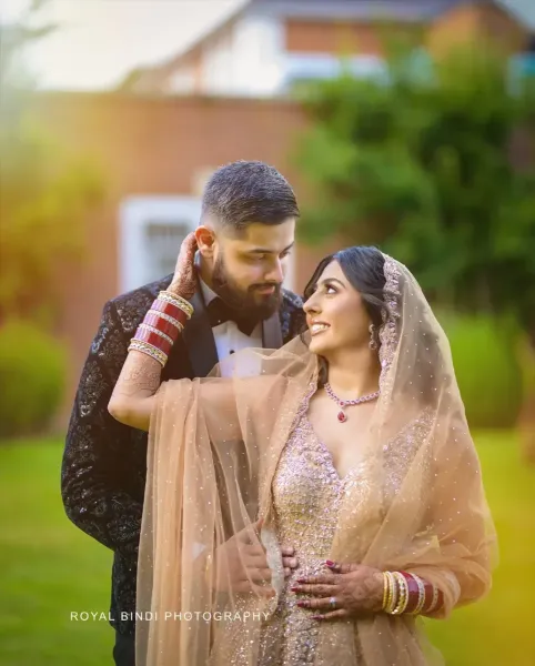 Couple reception photoshoot looking at each other.