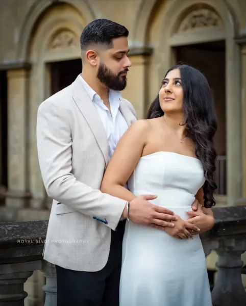 Couple looking at each other smiling.