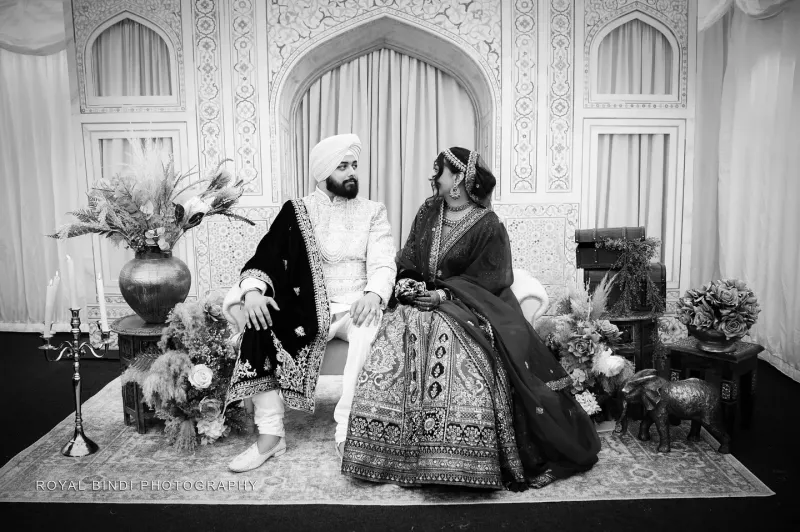 Black and white photography of couple looking at each other.