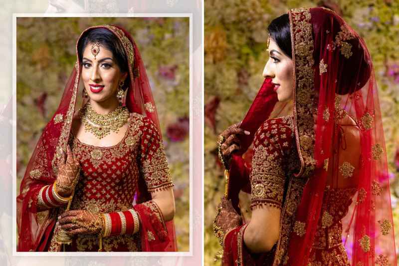 A woman in a traditional red and gold bridal lehenga with intricate embroidery, adorned with jewelry, including a necklace and earrings. She wears a matching veil, bangles, and mehndi on her hands, set against a floral background.