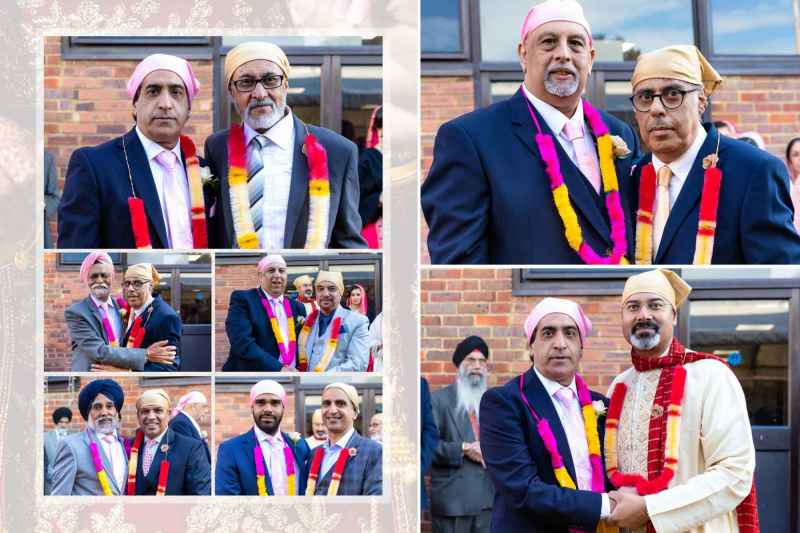 Group of men wearing traditional attire and colorful garlands at a cultural or religious event, posing in front of a brick building.