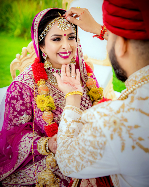 Indian couple doing sindur rasam.