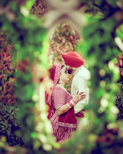 Sikh Groom kissing on her head.