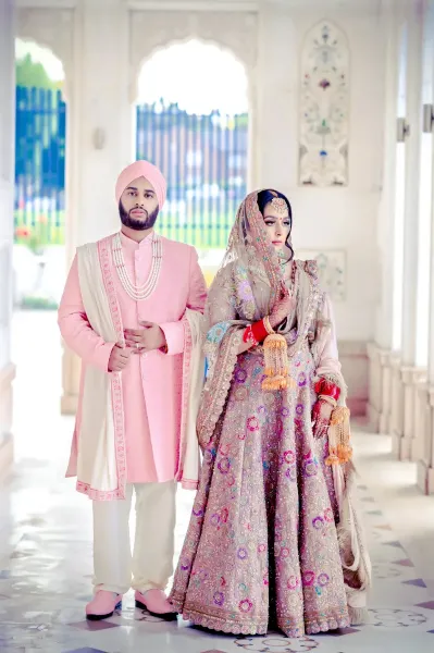 Sikh bride and groom posing for a picture