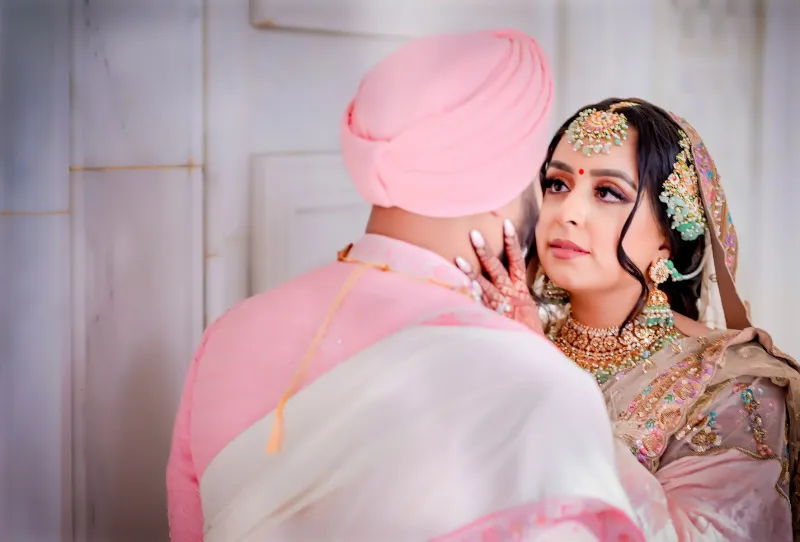 Sikh bridal looking at the Groom.