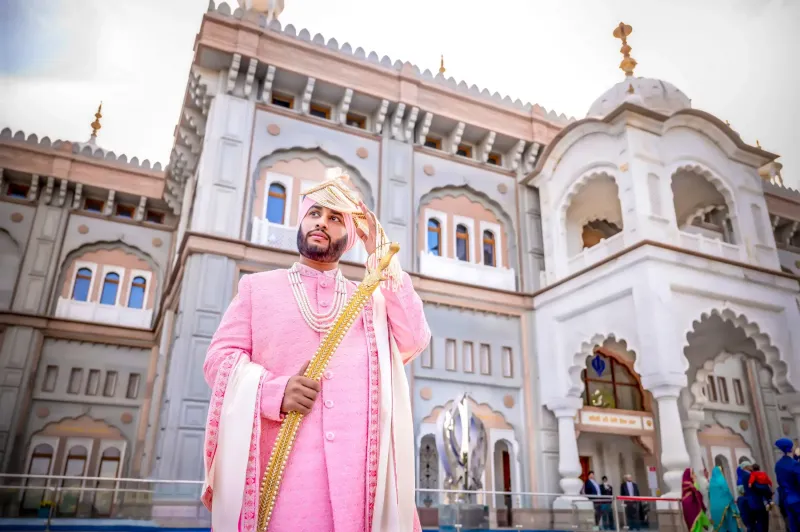 Sikh groom standing outside the Gurdwara.