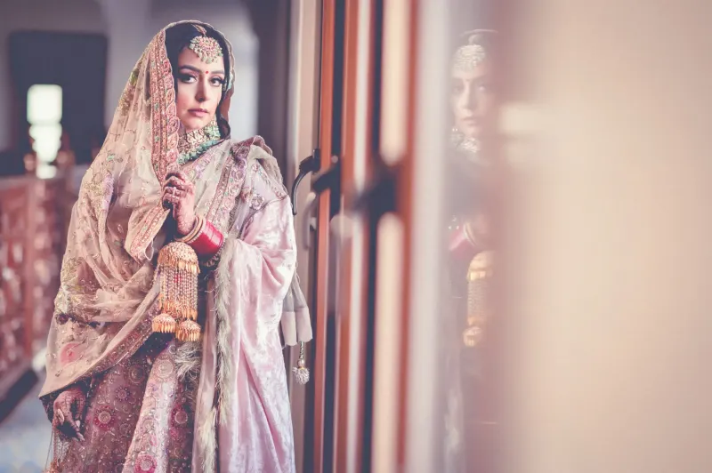 Bridal photography looking through the window.