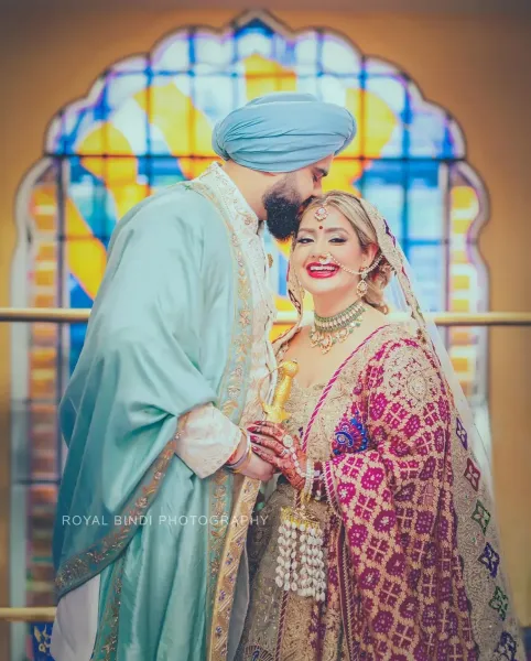 Sikh wedding couple showing the love and affection.