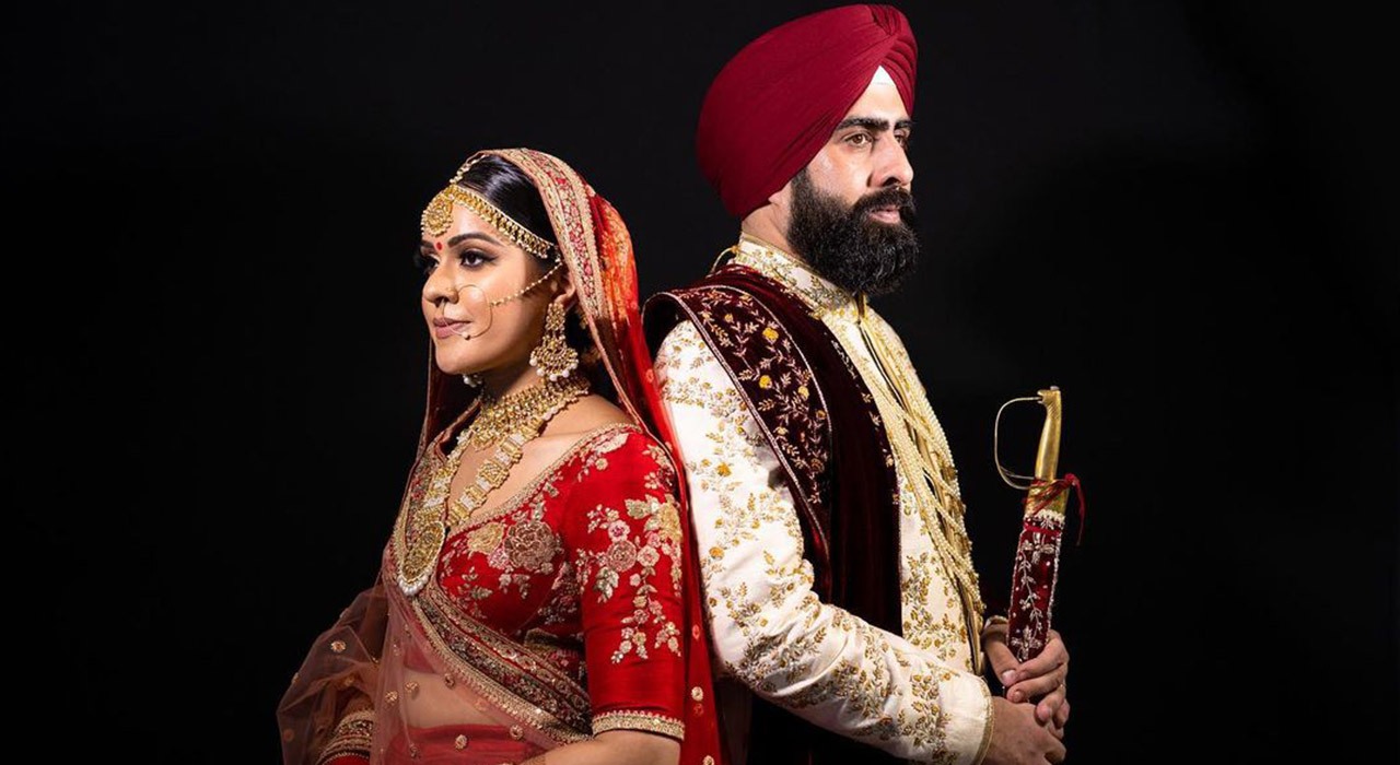 Sikh Wedding Couple with Sword in Opposite Sides