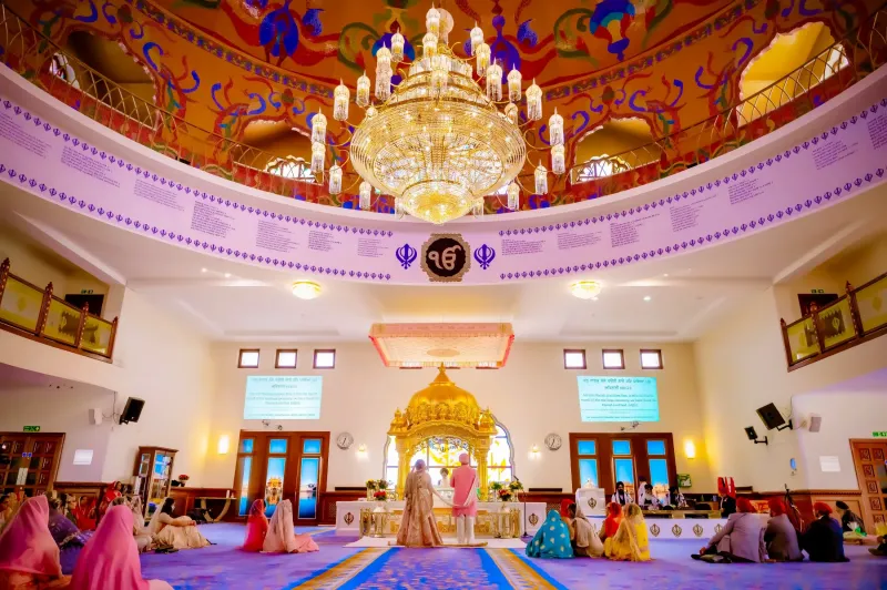 Sikh Wedding Ceremony in a Gurdwara Under a Grand Chandelier