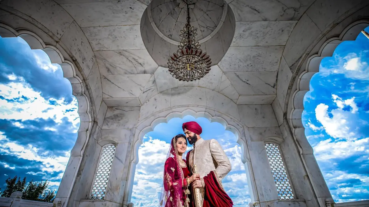 Sikh couple posing at Gurdwara