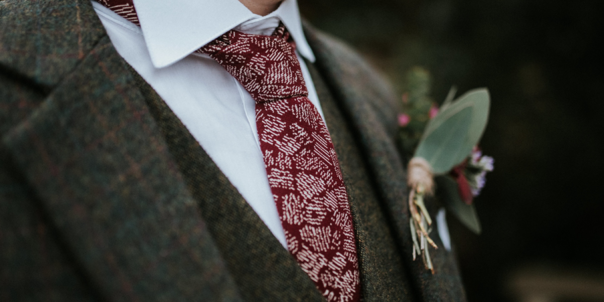 a-close-up-of-the-groom’s-grooms’-outfit-details