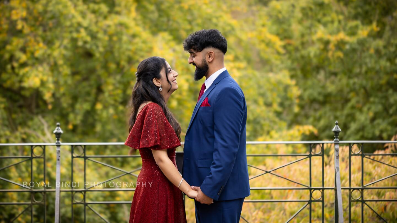 A Couple Standing In a Garden Gazing Into Each Other Eyes Surrounded By Natural Beauty