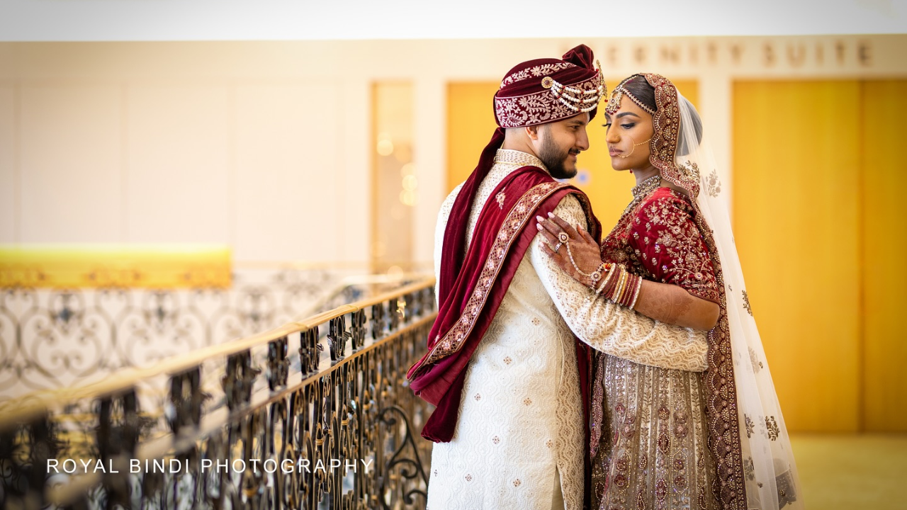 A beautiful couple standing gracefully on a sliding, capturing a romantic moment