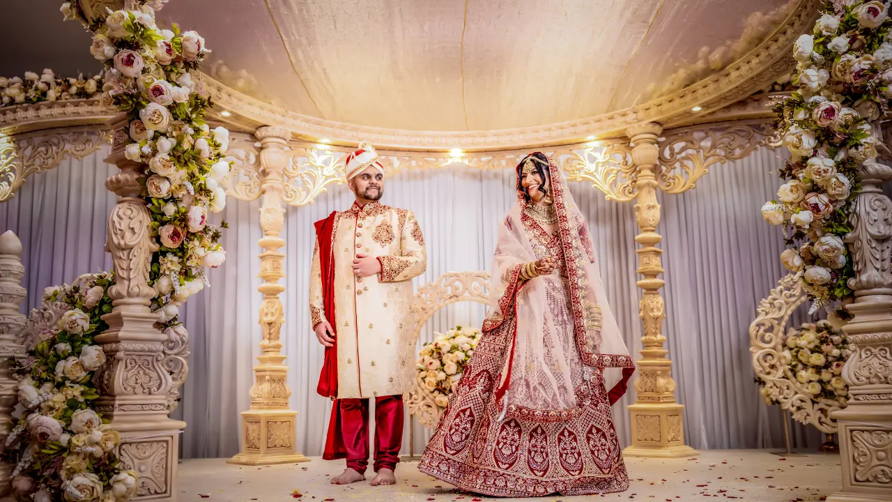 Indian couple standing on the Mandap stage