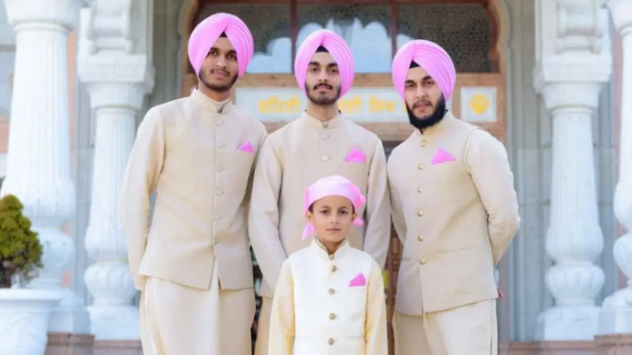 A group of Sikh boys wearing traditional sikh wedding clothes