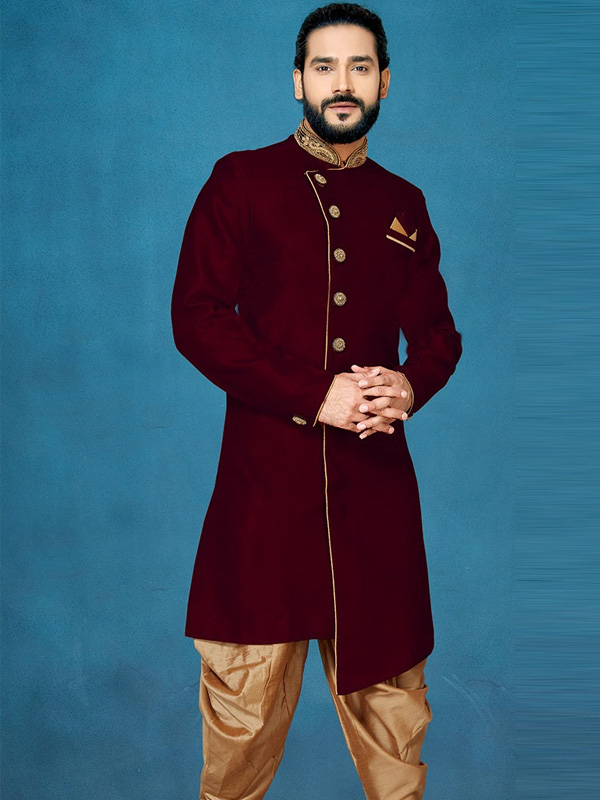 Man in maroon sherwani with golden detailing