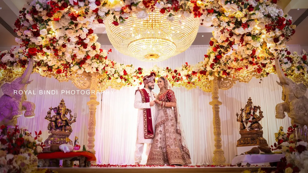 Traditional Asian Bride and Groom Standing on the Wedding Stage