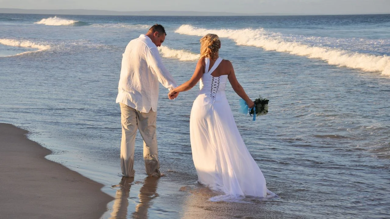 Couple holding hands on a beach