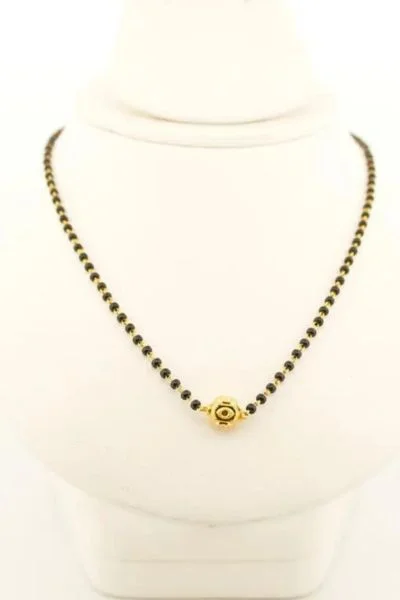 Brass mangalsutra with gold-toned pendant.