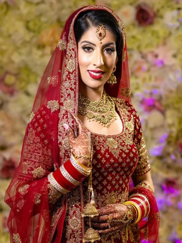 Bride in red lehenga with front draped dupatta