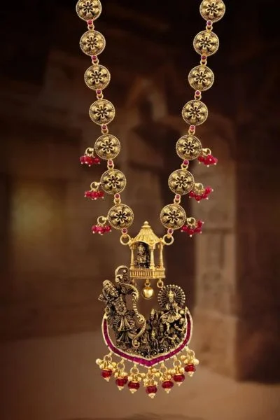 Gold mangalsutra with Radha Krishna pendant.