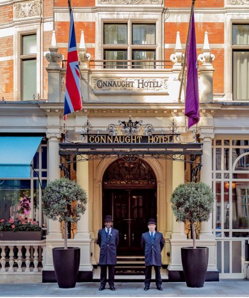 The Connaught Hotel in London. A luxurious hotel with ornate chandeliers and grand architecture.