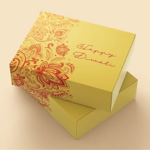 A yellow gift box with a red and gold paisley pattern and the text "Happy Diwali."