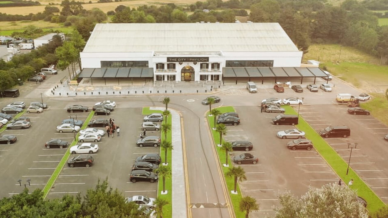 An aerial view of The City Pavilion, showcasing its sleek architecture and surrounding landscape.