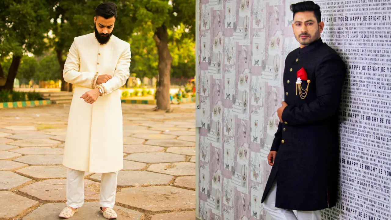 Two men wearing white kurtas and white dhotis are standing in a park. The man on the left is wearing a shirt over his kurta, and the man on the right is not. Both men are looking at the camera with serious expressions.