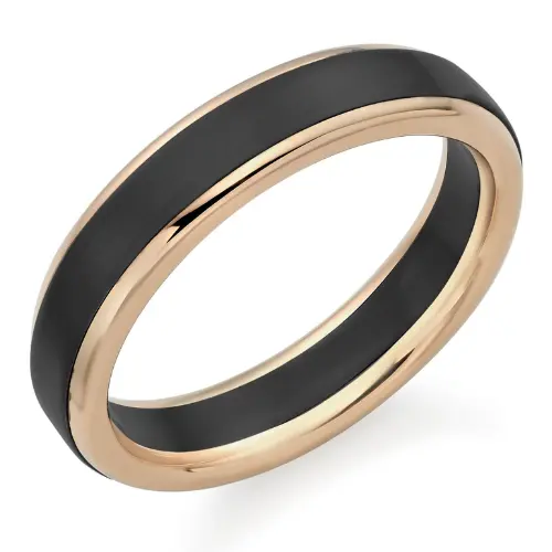 An engagement ring with a black ceramic center and a rose gold edge.