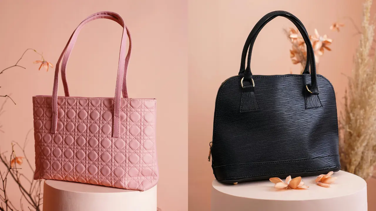 Two leather handbags, one pink with a quilted pattern and one black with a textured design, displayed on pedestals.