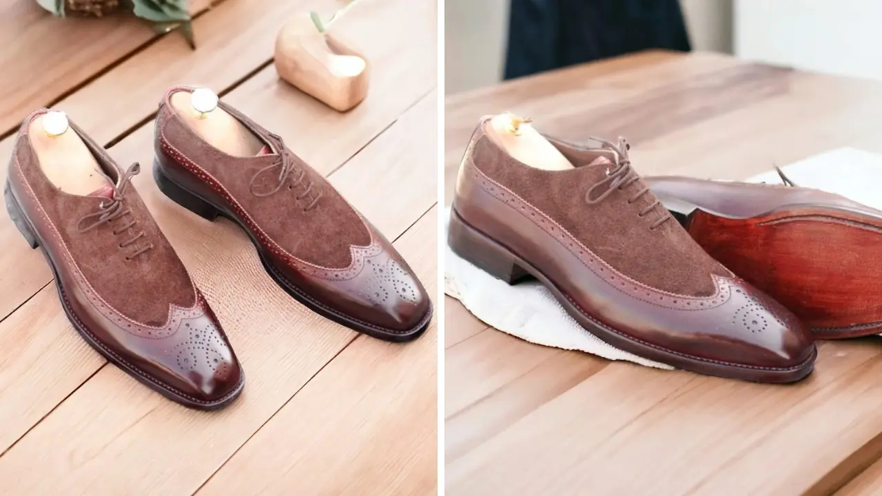 A pair of brown leather and suede Oxford shoes with brogue detailing and a wingtip toe.