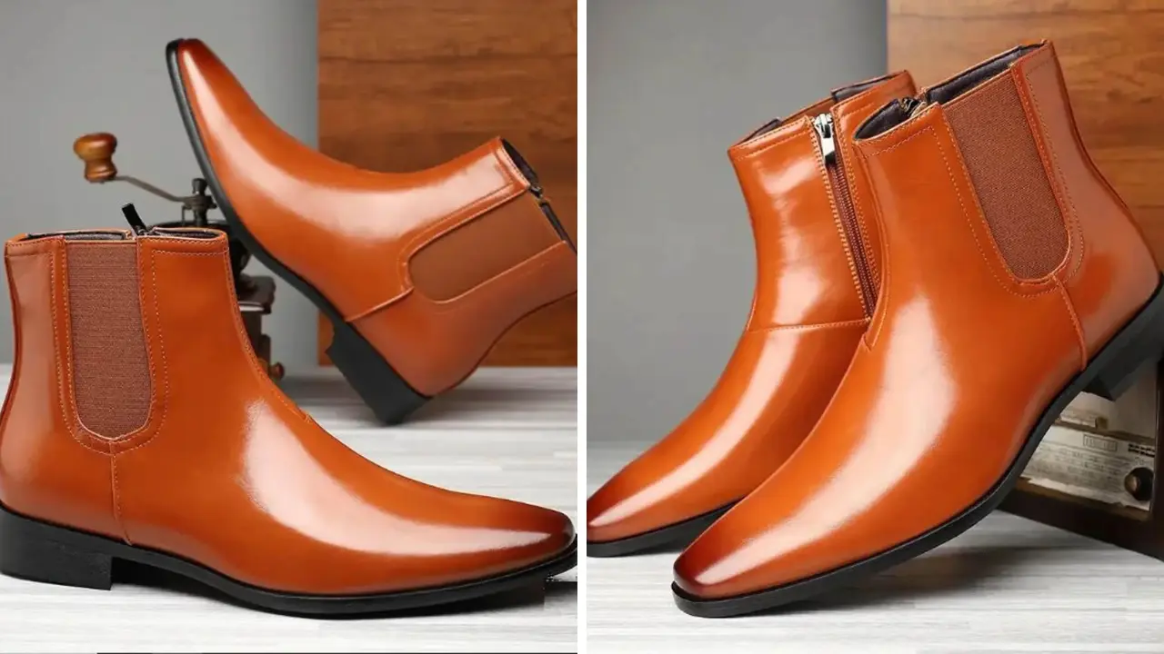 A pair of tan leather Chelsea boots with a pointed toe and a side zipper.