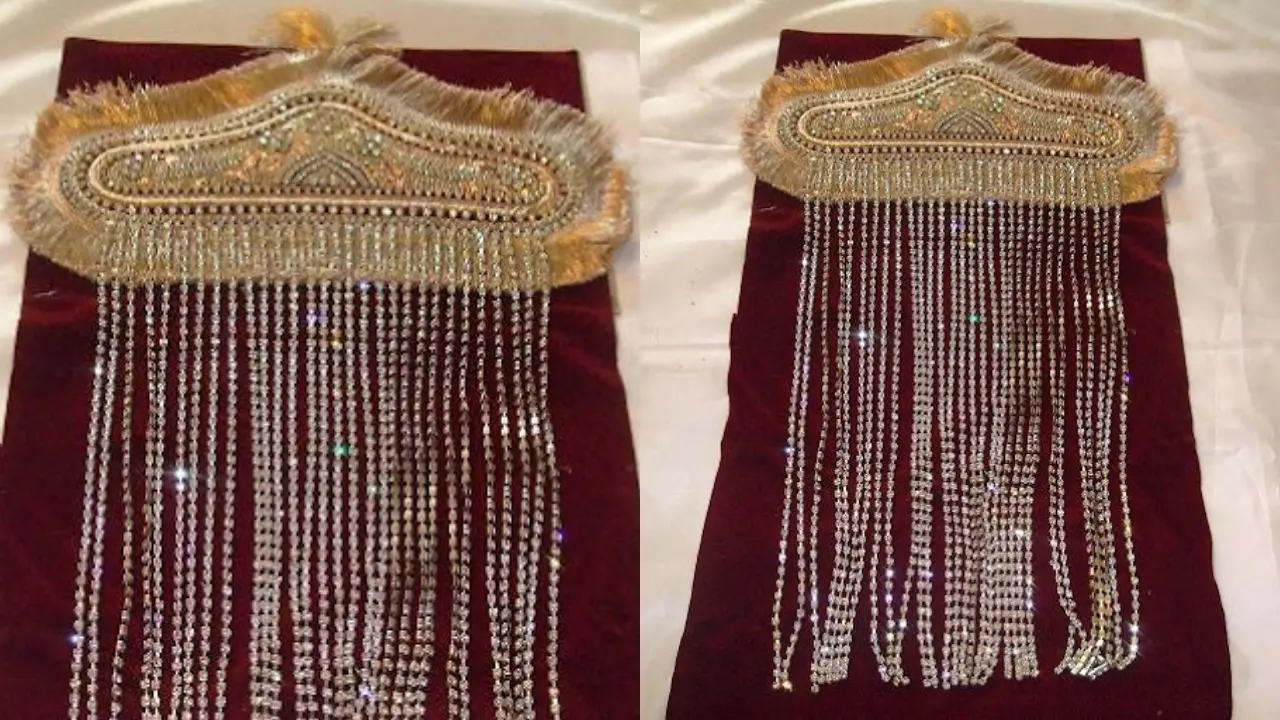 A Sehra, a traditional Indian groom's headpiece, adorned with crystals and long tassel chains.