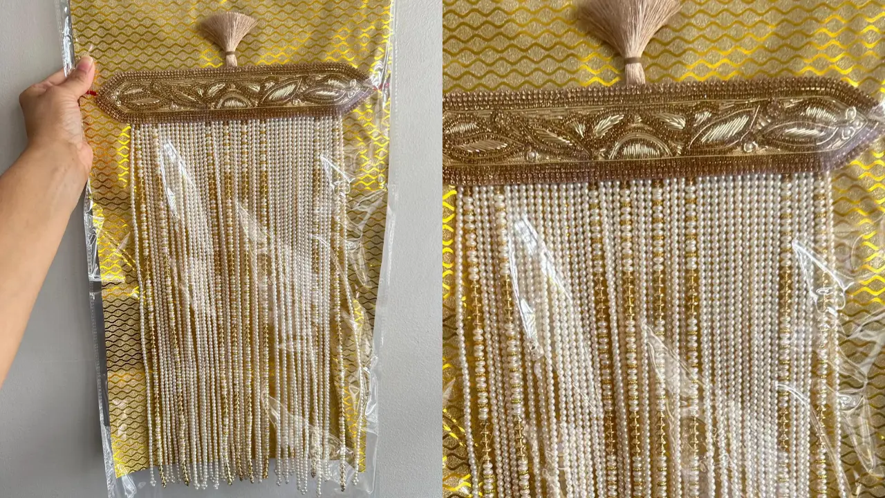 A Sehra, a traditional Indian groom's headpiece, with gold embroidery and long pearl tassels.