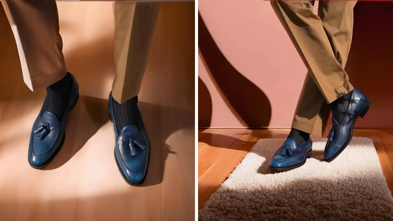 A pair of blue leather tassel loafers being worn with brown trousers.