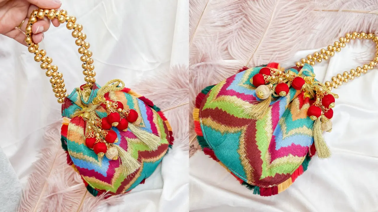 Two colorful embroidered potli bags with beaded handles and tassels, displayed on a white background with feathers.