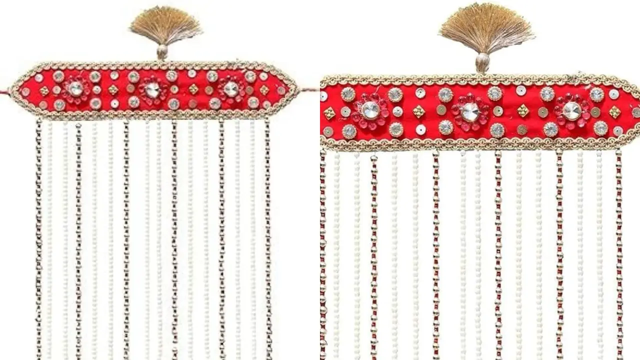 A Sehra, a traditional Indian groom's headpiece, featuring a red base with pearl tassels.