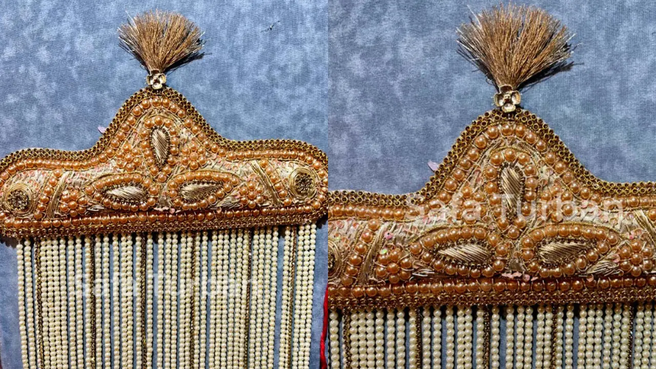 A Sehra, a traditional Indian groom's headpiece, featuring intricate beadwork and long pearl tassels.