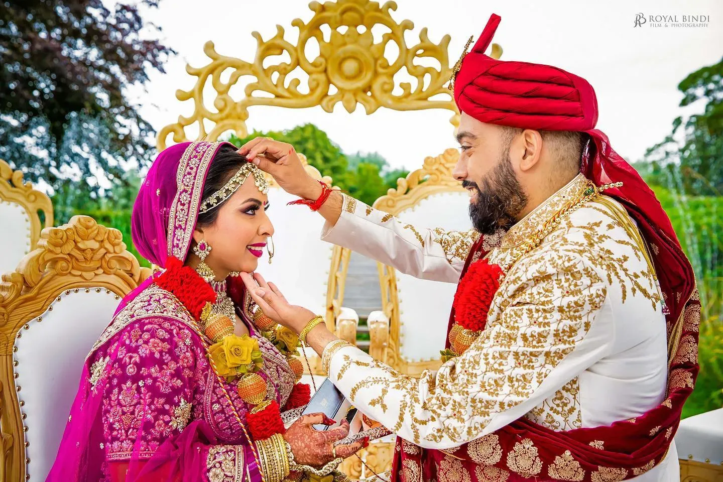 An intimate moment captured during a ritual ceremony at a Hindu wedding.