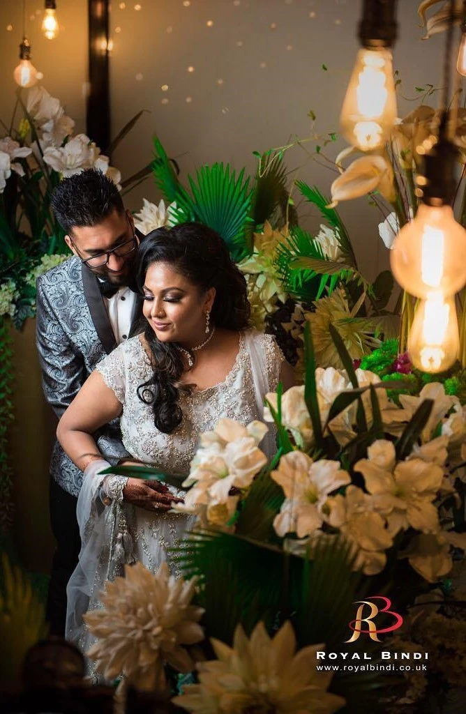 Intimate moment of a couple in traditional Gujarati wedding attire, captured during their photoshoot.